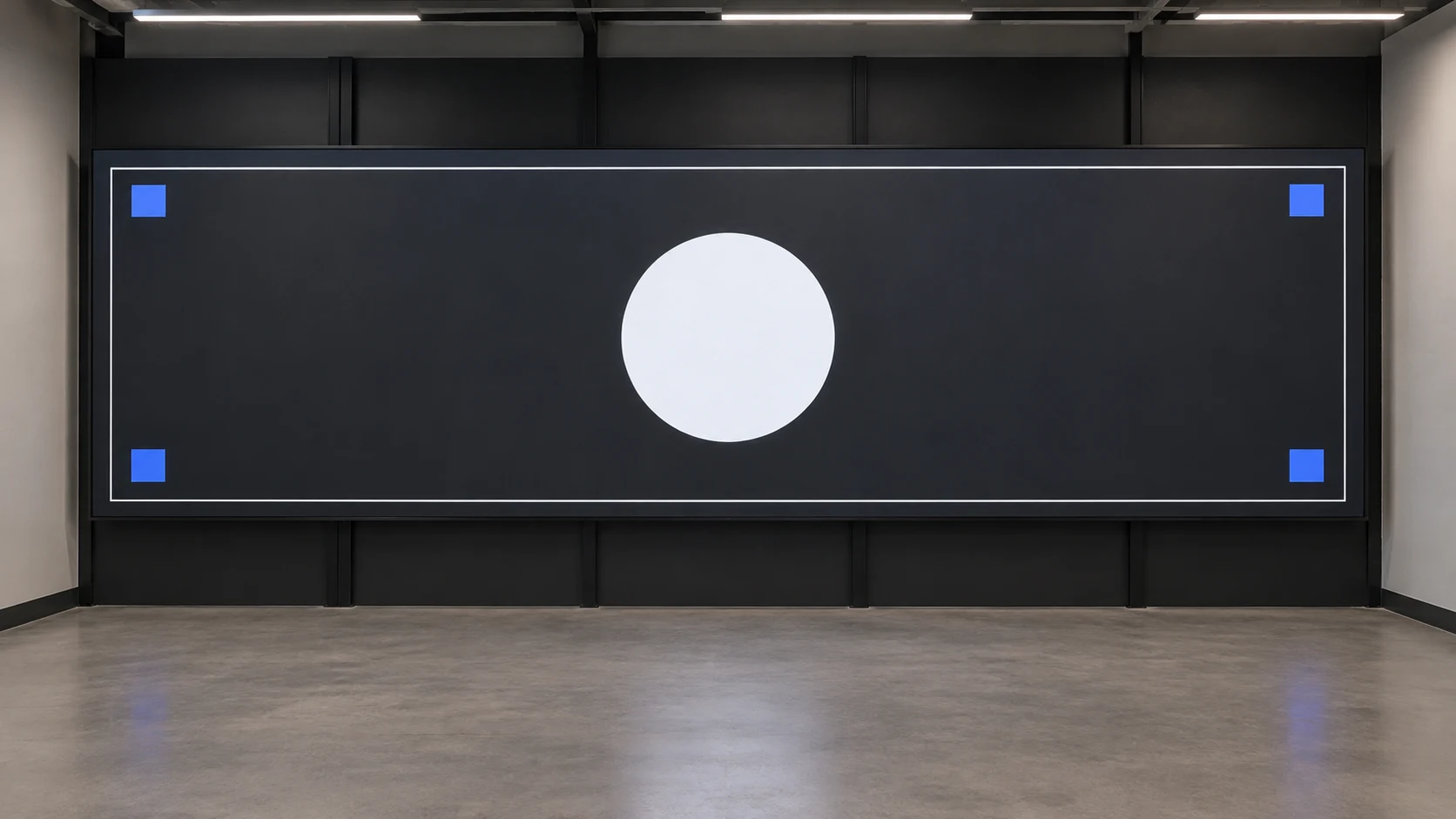 Wide LED wall showing an inset border, central circle and four blue corner markers